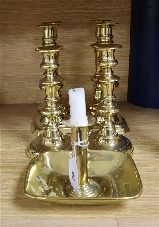 A Victorian brass chamberstick and three pairs of candlesticks